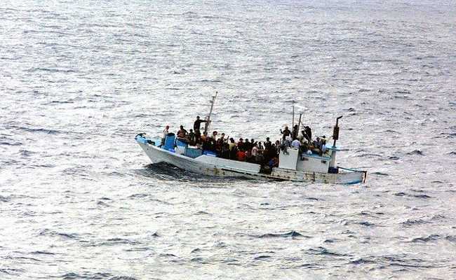 REFUGEES IN BOATS